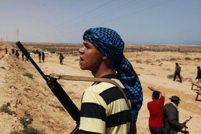 rebel-fighter-moves-across-the-desert-in-eastern-libya Libyan rebels